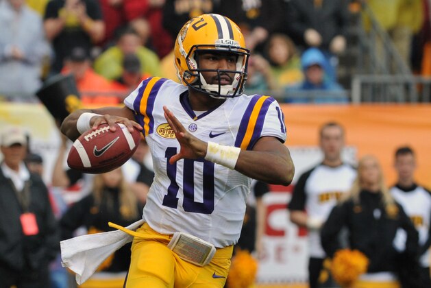 TAMPA, FL -  JANUARY 1:  Quarterback Anthony Jennings #10 of the LSU Tigers sets to pass in the second quarter against the Iowa Hawkeyes January 1, 2014  in the Outback Bowl at Raymond James Stadium in Tampa, Florida.  (Photo by Al Messerschmidt/Getty Images)