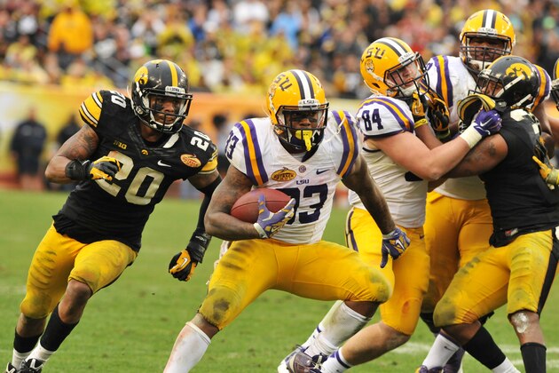 TAMPA, FL -  JANUARY 1:  Running back Jeremy Hill #33 of the LSU Tigers rushes upfield against the Iowa Hawkeyes January 1, 2014  in the Outback Bowl at Raymond James Stadium in Tampa, Florida.  LSU won 21-14. (Photo by Al Messerschmidt/Getty Images)