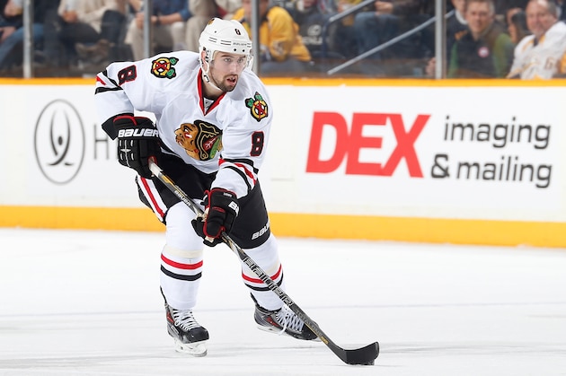 NASHVILLE, TN - DECEMBER 17: Nick Leddy #8 of the Chicago Blackhawks skates against the Nashville Predators at Bridgestone Arena on December 17, 2013 in Nashville, Tennessee. (Photo by John Russell/NHLI via Getty Images)