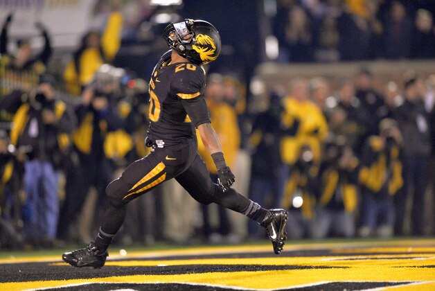 Nov 30, 2013; Columbia, MO, USA; Missouri Tigers running back Henry Josey (20) celebrates after rushing 57-yards for a touchdown against the Texas A&M Aggies during the second half at Faurot Field. Missouri defeated Texas A&M 28-21. Mandatory Credit: Peter G. Aiken-USA TODAY Sports