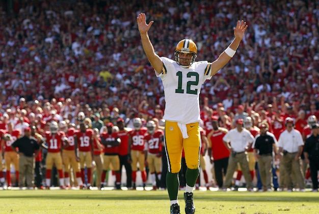 Sep 8, 2013; San Francisco, CA, USA; Green Bay Packers quarterback Aaron Rodgers (12) reacts after running back Eddie Lacy (not pictured) scored a touchdown against the San Francisco 49ers in the fourth quarter at Candlestick Park. The 49ers defeated the Packers 34-28. Mandatory Credit: Cary Edmondson-USA TODAY Sports
