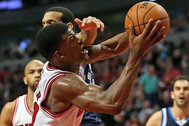 CHICAGO, IL - DECEMBER 28: Jimmy Butler #21 of the Chicago Bulls is fouled while shooting by Brandon Wright #34 of the Dallas Mavericks at the United Center on December 28, 2013 in Chicago, Illinois. The Mavericks defeated the Bulls 105-83. NOTE TO USER: User expressly acknowledges and agrees that, by downloading and or using this photograph, User is consenting to the terms and conditions of the Getty Images License Agreement. (Photo by Jonathan Daniel/Getty Images) CHICAGO, IL - DECEMBER 28: Jimmy Butler #21 of the Chicago Bulls is fouled while shooting by Brandon Wright #34 of the Dallas Mavericks at the United Center on December 28, 2013 in Chicago, Illinois. The Mavericks defeated the Bulls 105-83. NOTE TO USER: User expressly acknowledges and agrees that, by downloading and or using this photograph, User is consenting to the terms and conditions of the Getty Images License Agreement. (Photo by Jonathan Daniel/Getty Images)