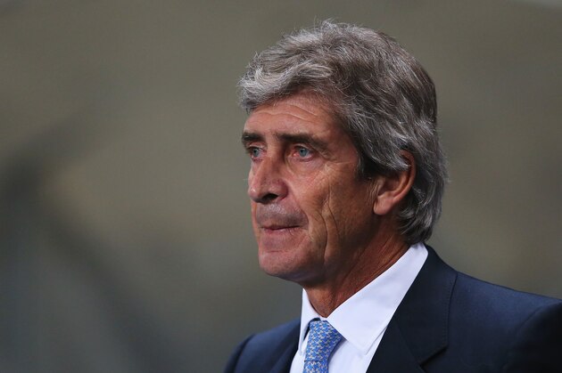 MANCHESTER, ENGLAND - DECEMBER 26: Manuel Pellegrini, manager of Manchester City looks on prior to the Barclays Premier League match between Manchester City and Liverpool at Etihad Stadium on December 26, 2013 in Manchester, England.  (Photo by Alex Livesey/Getty Images)