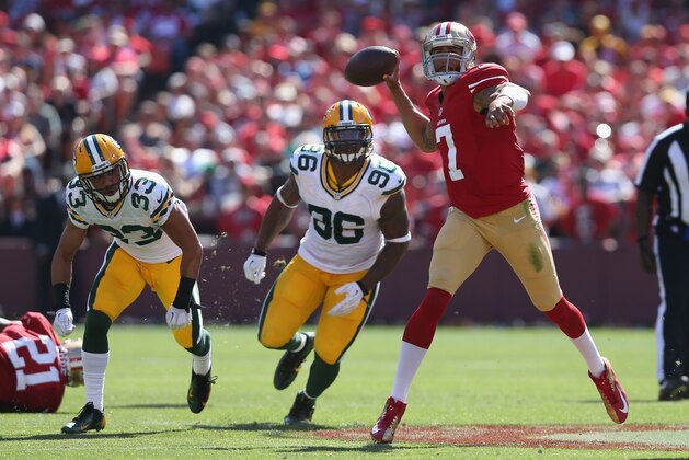 SAN FRANCISCO, CA - SEPTEMBER 08:  Quarterback Colin Kaepernick #7 of the San Francisco 49ers is pursued by Micah Hyde #33 and Mike Neal #96 of the Green Bay Packers at Candlestick Park on September 8, 2013 in San Francisco, California.  (Photo by Jeff Gross/Getty Images)