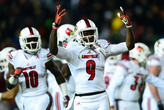 Dec 5, 2013; Cincinnati, OH, USA; Louisville Cardinals wide receiver DeVante Parker (9) celebrates after catching a pass for a touchdown during the first quarter against the Cincinnati Bearcats at Nippert Stadium. Mandatory Credit: Andrew Weber-USA TODAY Sports