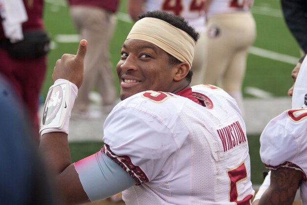 Nov 9, 2013; Winston-Salem, NC, USA; Florida State Seminoles quarterback Jameis Winston (5) smiles on the bench during the fourth quarter against the Wake Forest Demon Deacons at BB&T Field. Florida State defeated Wake Forest 59-3. Mandatory Credit: Jeremy Brevard-USA TODAY Sports