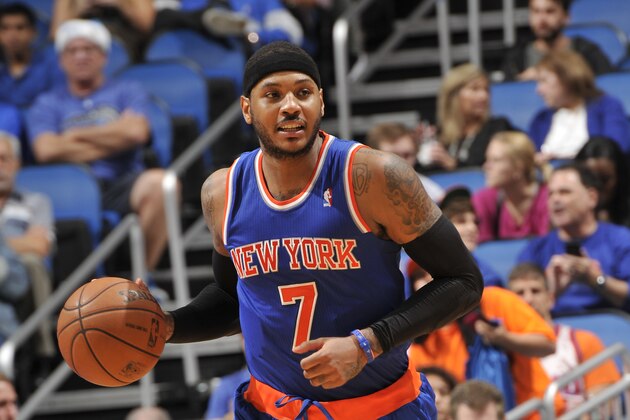 ORLANDO, FL - DECEMBER 23: Carmelo Anthony #7 of the New York Knicks dribbles up the court against the Orlando Magic during the game on December 23, 2013 at Amway Center in Orlando, Florida. NOTE TO USER: User expressly acknowledges and agrees that, by downloading and or using this photograph, User is consenting to the terms and conditions of the Getty Images License Agreement. Mandatory Copyright Notice: Copyright 2013 NBAE  (Photo by Fernando Medina/NBAE via Getty Images)