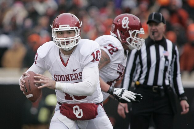 STILLWATER, OK - DECEMBER 7:  Quarterback Blake Bell #10 of the Oklahoma Sooners looks outside during the game against the Oklahoma State Cowboys December 7, 2013 at Boone Pickens Stadium in Stillwater, Oklahoma. Oklahoma defeated Oklahoma State 33-24. (Photo by Brett Deering/Getty Images)