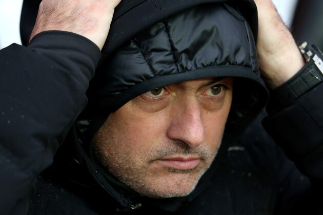 SOUTHAMPTON, ENGLAND - JANUARY 01:  Jose Mourinho the Chelsea manager braves the elements  during the Barclays Premier League match between Southampton and Chelsea at St Mary's Stadium on January 1, 2014 in Southampton, England.  (Photo by Warren Little/Getty Images)