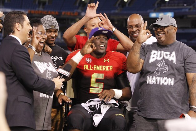 Jan 2, 2014; St. Petersburg, FL, USA; Team Highlight running back Leonard Fournette (5) verbally commits to LSU Tigers with his family on ESPN during the second half at Tropicana Field. Team Highlight defeated the Team Nitro 31-21. Mandatory Credit: Kim Klement-USA TODAY Sports
