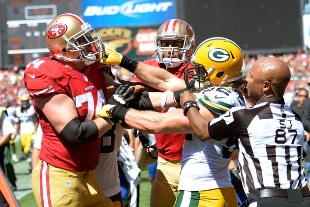 SAN FRANCISCO, CA - SEPTEMBER 08:  Clay Matthews #52 of the Green Bay Packers and Joe Staley #74 of the San Francisco 49ers gets into a fight after Matthews hit quarterback Colin Kaepernick #7 late out of bounds during the second quarter at Candlestick Park on September 8, 2013 in San Francisco, California.  (Photo by Thearon W. Henderson/Getty Images)
