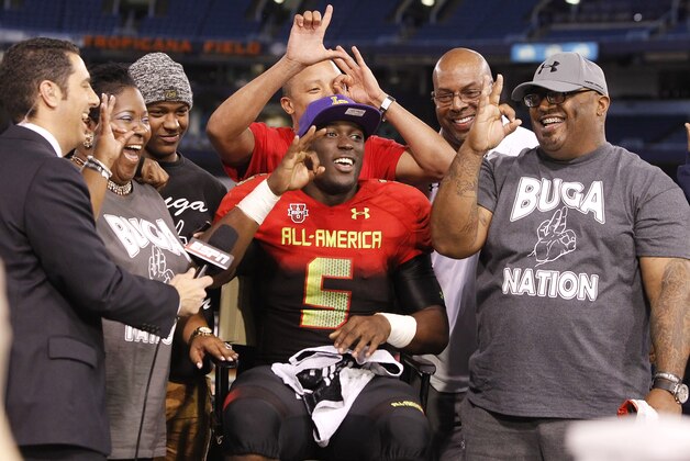 Jan 2, 2014; St. Petersburg, FL, USA; Team Highlight running back Leonard Fournette (5) verbally commits to LSU Tigers with his family on ESPN during the second half at Tropicana Field. Team Highlight defeated the Team Nitro 31-21. Mandatory Credit: Kim Klement-USA TODAY Sports