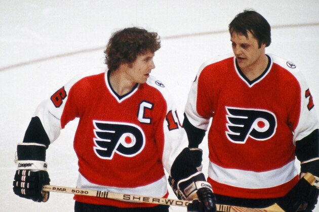 BOSTON, MA. - 1978: Bobby Clarke #16 and Bill Barber #7 of the Philadelphia Flyers talk during break in play against the Boston Bruins at Boston Garden.  (Photo by Steve Babineau/NHLI via Getty Images)
