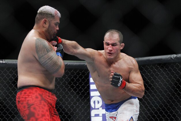 May 25, 2013; Las Vegas, NV, USA; Junior dos Santos lands a punch against Mark Hunt during UFC 160 at the MGM Grand Garden Arena. Mandatory Credit: Gary A. Vasquez-USA TODAY Sports
