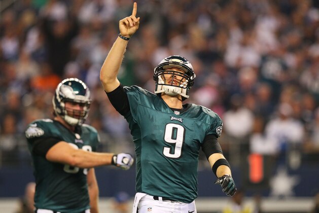ARLINGTON, TX - DECEMBER 29:  Nick Foles #9 of the Philadelphia Eagles celebrates a second quarter touchdown against the Dallas Cowboys at Cowboys Stadium on December 29, 2013 in Arlington, Texas.  (Photo by Ronald Martinez/Getty Images)