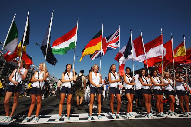 MELBOURNE, AUSTRALIA - MARCH 16:  Grid girls hold the national flags of all of drivers nationalities before the Australian Formula One Grand Prix at the Albert Park Circuit on March 16, 2008 in Melbourne, Australia.  (Photo by Mark Thompson/Getty Images)