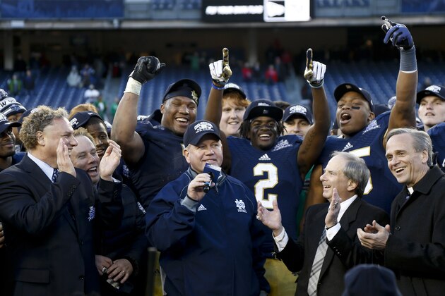 NEW YORK, NY - DECEMBER 28:  Head coach Brian Kelly of the Notre Dame Fighting Irish celebrates winning against the Rutgers Scarlet Knights in  the New Era Pinstripe Bowl at Yankee Stadium on December 28, 2013 in the Bronx borough of New York City.  (Photo by Jeff Zelevansky/Getty Images)