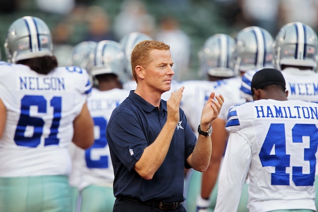 OAKLAND, CA - AUGUST 9:  Head coach Jason Garrett of the Dallas Cowboys encourages his team before a preseason game against the Oakland Raiders on August 9, 2013 at O.co Coliseum in Oakland, California.  (Photo by Brian Bahr/Getty Images)
