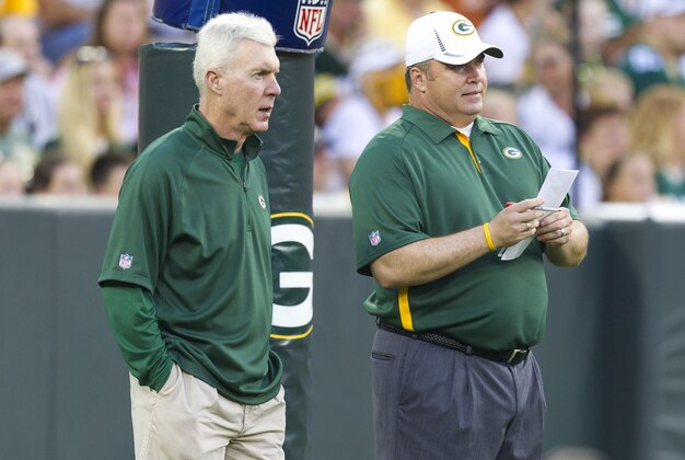 August 3, 2012; Green Bay, WI, USA; Green Bay Packers general manager Ted Thompson (left) talks with head coach Mike McCarthy prior to the family night scrimmage at Lambeau Field in Green Bay, WI. Mandatory Credit: Jeff Hanisch-USA TODAY Sports
