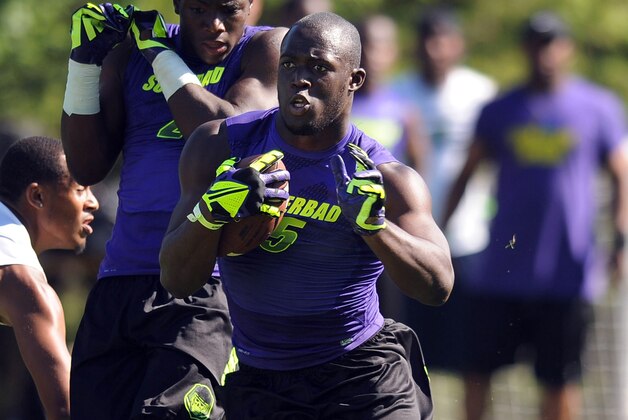 Jul 2, 2013; Beaverton, OR, USA; Running back Leonard Fournette (5) runs with the ball during the Nike 7on7 pool play at Nike World Headquarters in Beaverton, Oregon on Tuesday July, 2, 2013. Mandatory Credit: Steve Dykes-USA TODAY Sports