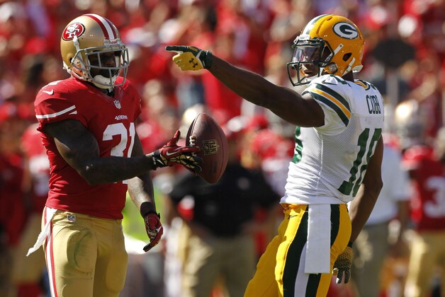 Sep 8, 2013; San Francisco, CA, USA; Green Bay Packers wide receiver Randall Cobb (18) reacts after picking up a first down next to San Francisco 49ers safety Donte Whitner (31) in the third quarter at Candlestick Park. The 49ers defeated the Packers 34-28. Mandatory Credit: Cary Edmondson-USA TODAY Sports