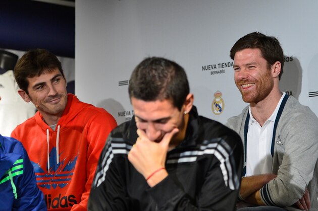 MADRID, SPAIN - FEBRUARY 21:  Players of Real Madrid CF (L-R) Alvaro Arbeloa, Iker Casillas, Angel Di Mariaand Xabi Alonso attend the opening of the new 'Adidas' store at the Santiago Bernabeu stadium on February 21, 2013 in Madrid, Spain.  (Photo by Carlos Alvarez/Getty Images)