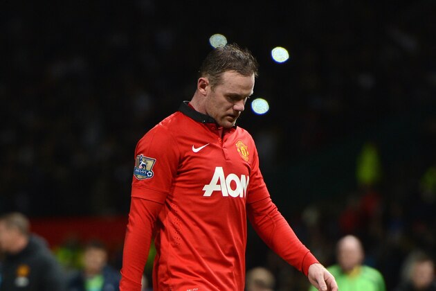 MANCHESTER, ENGLAND - JANUARY 01:  Wayne Rooney of Manchester United walks off at the end of the Barclays Premier League match between Manchester United and Tottenham Hotspur at Old Trafford on January 1, 2014 in Manchester, England.  (Photo by Michael Regan/Getty Images)