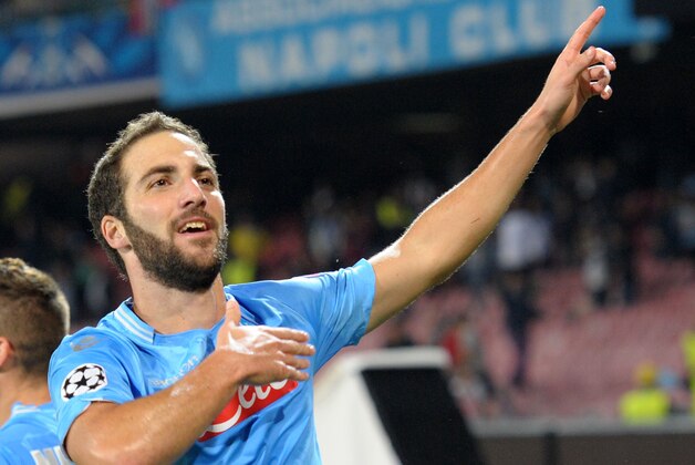 NAPLES, ITALY - NOVEMBER 06:  Gonzalo Higuain of Napoli celebrates after scoring their second goal during the UEFA Champions League Group F match between SSC Napoli and Olympique de Marseille at Stadio San Paolo on November 6, 2013 in Naples, Italy.  (Photo by Giuseppe Bellini/Getty Images)