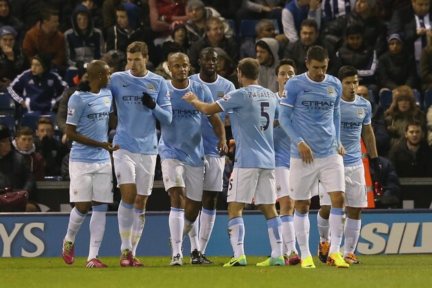 WEST BROMWICH, ENGLAND - DECEMBER 04:  Manchester City players celebrate after Yaya Toure scores their second goal during the Premier League match between West Bromwich Albion and Manchester City at The Hawthorns on December 4, 2013 in West Bromwich, England.  (Photo by David Rogers/Getty Images)