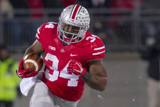 Nov 23, 2013; Columbus, OH, USA;  Ohio State Buckeyes running back Carlos Hyde (34) runs the ball in the third quarter of the game against the Indiana Hoosiers at Ohio Stadium. Ohio State Buckeyes beat Indiana Hoosiers 42-14. Mandatory Credit: Trevor Ruszkowksi-USA TODAY Sports