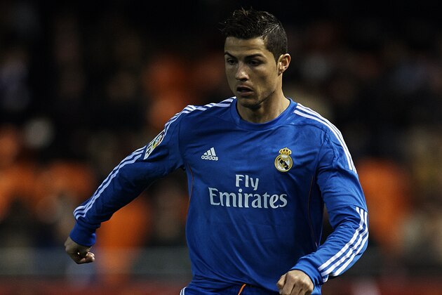 VALENCIA, SPAIN - DECEMBER 22:  Cristiano Ronaldo of Real Madrid runs with the ball during the La Liga match between Valencia CF and Real Madrid CF at Estadio Mestalla on December 22, 2013 in Valencia, Spain.  (Photo by Manuel Queimadelos Alonso/Getty Images)