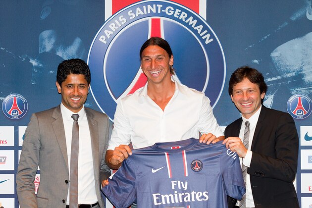 PARIS, FRANCE - JULY 18:  Nasser Al Khelaifi (L) and Leonardo Nascimento de Araujo ( (R) welcome Zlatan Ibrahimovic (C) during the press conference for Paris Saint Germain at Parc des Princes on July 18, 2012 in Paris, France.  (Photo by Marc Piasecki/Getty Images)
