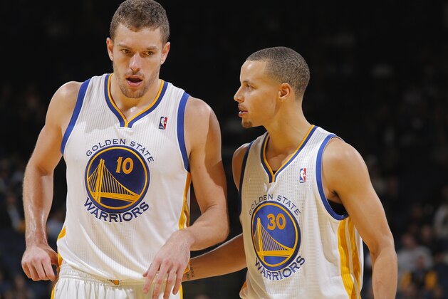 OAKLAND, CA - DECEMBER 17: Teammates David Lee #10 and Stephen Curry #30 of the Golden State Warriors talk while facing the New Orleans Pelicans on December 17, 2013 at Oracle Arena in Oakland, California. NOTE TO USER: User expressly acknowledges and agrees that, by downloading and or using this photograph, user is consenting to the terms and conditions of Getty Images License Agreement. Mandatory Copyright Notice: Copyright 2013 NBAE (Photo by Rocky Widner/NBAE via Getty Images)