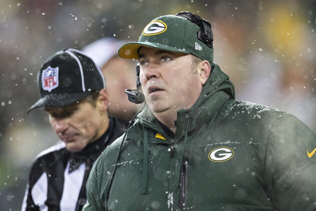 GREEN BAY, WI - DECEMBER 22:  Head Coach Mike McCarthy of the Green Bay Packers watches a replay on the scoreboard in the snow during a game against the Pittsburgh Steelers at Lambeau Field on December 22, 2013 in Green Bay, Wisconsin.  The Steelers defeated the Packers 38-31.  (Photo by Wesley Hitt/Getty Images)