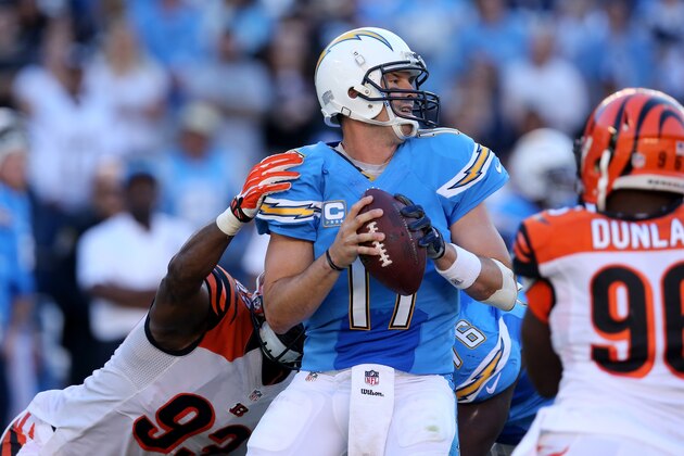 SAN DIEGO, CA - DECEMBER 01:  Quarterback Philip Rivers #17 of the San Diego Chargers trys to pass against the rush of defensive tackle Domata Peko #93 of Cincinnati Bengals at Qualcomm Stadium on December 1, 2013 in San Diego, California. The Bengals won 17-10.  (Photo by Stephen Dunn/Getty Images)