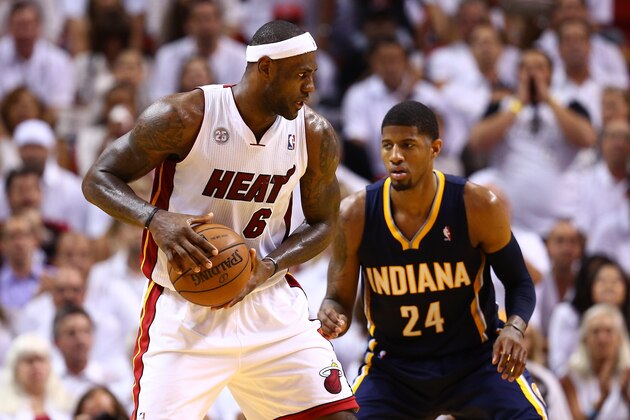 MIAMI, FL - MAY 30:  LeBron James #6 of the Miami Heat handles the ball against Paul George #24 of the Indiana Pacers in the third quarter during Game Five of the Eastern Conference Finals at AmericanAirlines Arena on May 30, 2013 in Miami, Florida. NOTE TO USER: User expressly acknowledges and agrees that, by downloading and or using this photograph, user is consenting to the terms and conditions of the Getty Images License Agreement.  (Photo by Streeter Lecka/Getty Images)