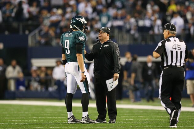 ARLINGTON, TX - DECEMBER 29:   Nick Foles #9 talks to head coach Chip Kelly of the Philadelphia Eagles during the second half of their game against the Dallas Cowboys at Cowboys Stadium on December 29, 2013 in Arlington, Texas.  (Photo by Ronald Martinez/Getty Images)