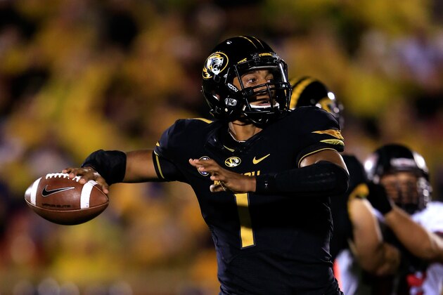 COLUMBIA, MO - SEPTEMBER 28:  Quarterback James Franklin #1 of the Missouri Tigers passes during the game against the Arkansas State Red Wolves at Faurot Field/Memorial Stadium on September 28, 2013 in Columbia, Missouri.  (Photo by Jamie Squire/Getty Images)