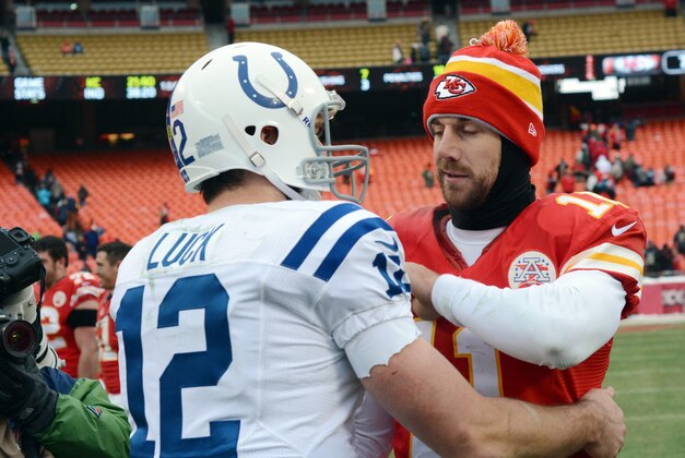 Dec 22, 2013; Kansas City, MO, USA; Kansas City Chiefs quarterback Alex Smith (11) congratulates Indianapolis Colts quarterback Andrew Luck (12) after the game at Arrowhead Stadium. The Colts won 23-7. Mandatory Credit: Denny Medley-USA TODAY Sports