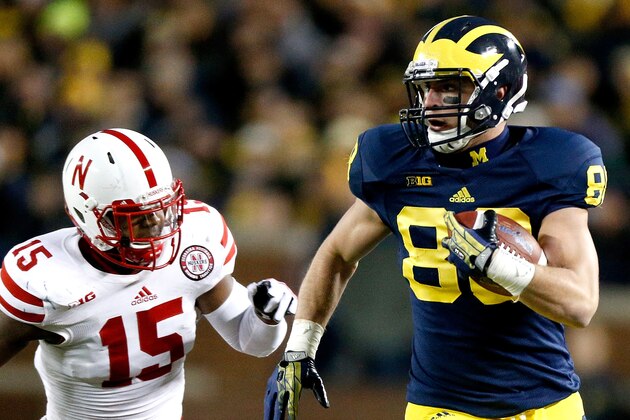 ANN ARBOR, MI - NOVEMBER 09:  Jake Butt #88 of the Michigan Wolverines heads down the sideline against Michael Rose #15 of the Nebraska Cornhuskers in the third quarter at Michigan Stadium on November 9, 2013 in Ann Arbor, Michigan.  (Photo by Gregory Shamus/Getty Images)