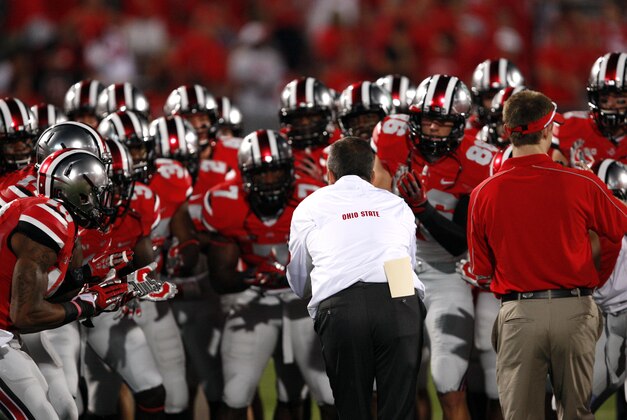 Sep 28, 2013; Columbus, OH, USA; Ohio State Buckeyes head coach Urban Meyer pumps the team up before the game against the Wisconsin Badgers at Ohio Stadium. Mandatory Credit: Raj Mehta-USA TODAY Sports
