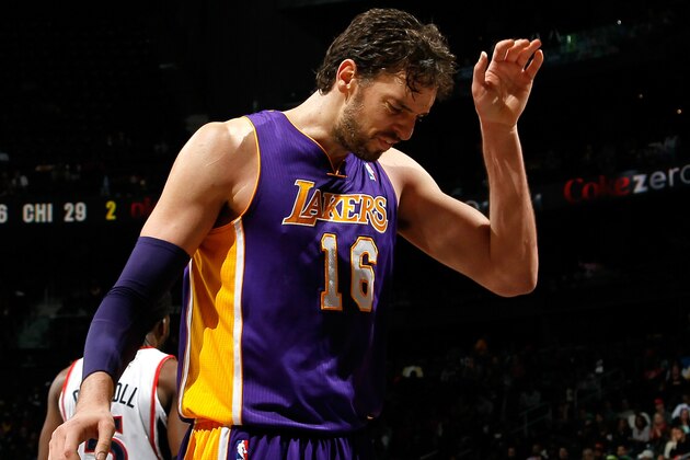 ATLANTA, GA - DECEMBER 16:  Pau Gasol #16 of the Los Angeles Lakers reacts after a teammate was called for a foul against the Atlanta Hawks at Philips Arena on December 16, 2013 in Atlanta, Georgia.  NOTE TO USER: User expressly acknowledges and agrees that, by downloading and or using this photograph, User is consenting to the terms and conditions of the Getty Images License Agreement.  (Photo by Kevin C. Cox/Getty Images)
