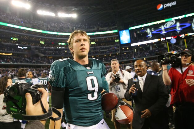 ARLINGTON, TX - DECEMBER 29:   Nick Foles #9 of the Philadelphia Eagles looks on after their 24 to 22 win over the Dallas Cowboys at Cowboys Stadium on December 29, 2013 in Arlington, Texas.  (Photo by Ronald Martinez/Getty Images)