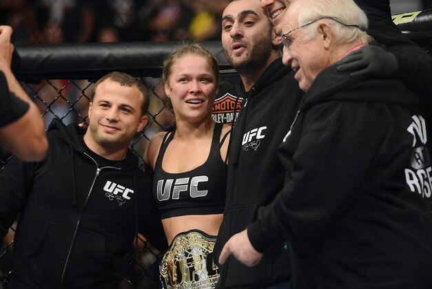 Dec 28, 2013; Las Vegas, NV, USA;    Ronda Rousey reacts with her corner after defeating Miesha Tate (not pictured) in their UFC women's bantamweight championship bout at the MGM Grand Garden Arena. Mandatory Credit: Jayne Kamin-Oncea-USA TODAY Sports