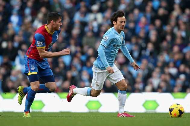 MANCHESTER, ENGLAND - DECEMBER 28:  Joel Ward of Crystal Palace challenges David Silva of Manchester City during the Barclays Premier League match between Manchester City and Crystal Palace at the Etihad Stadium on December 28, 2013 in Manchester, England.  (Photo by Jan Kruger/Getty Images)