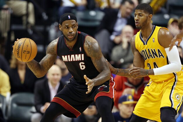 Dec 10, 2013; Indianapolis, IN, USA; Miami Heat  guard LeBron James (6) is guarded by Indiana Pacers forward Paul George (24) at Bankers Life Fieldhouse. Indiana defeats Miami 90-84. Mandatory Credit: Brian Spurlock-USA TODAY Sports