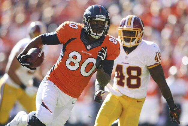 Oct 27, 2013; Denver, CO, USA; Denver Broncos wide receiver Julius Thomas (80) runs with the ball after making a catch during the first half against the Washington Redskins at Sports Authority Field at Mile High. Mandatory Credit: Chris Humphreys-USA TODAY Sports
