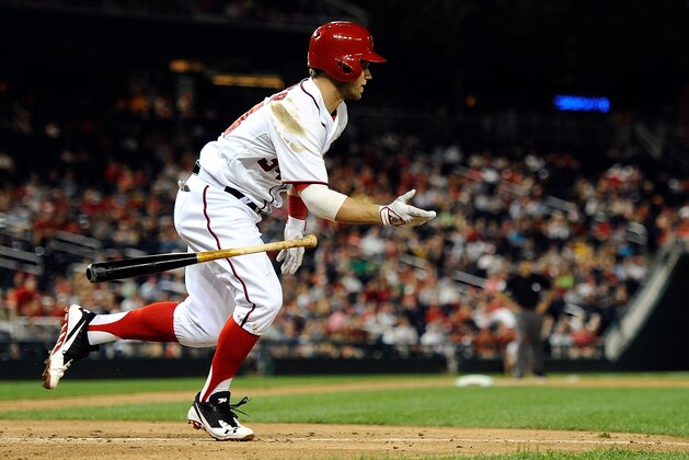 WASHINGTON, DC - AUGUST 09:  Bryce Harper #34 of the Washington Nationals runs to first base after hitting an RBI single, scoring Scott Hairston (not pictured) in the eighth inning during a game against the Philadelphia Phillies at Nationals Park on August 9, 2013 in Washington, DC.  (Photo by Patrick McDermott/Getty Images)