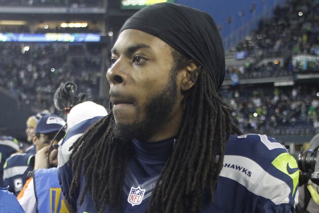 Dec 29, 2013; Seattle, WA, USA; Seattle Seahawks cornerback Richard Sherman (25) walks off the field following a 29-7 victory against the St. Louis Rams at CenturyLink Field. Mandatory Credit: Joe Nicholson-USA TODAY Sports