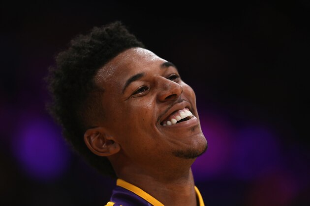 LOS ANGELES, CA - OCTOBER 29:  Nick Young #0 of the Los Angeles Lakers smiles prior to the start of the game against the Los Angeles Clippers at Staples Center on October 29, 2013 in Los Angeles, California. NOTE TO USER: User expressly acknowledges and agrees that, by downloading and or using this photograph, User is consenting to the terms and conditions of the Getty Images License Agreement.  (Photo by Jeff Gross/Getty Images)